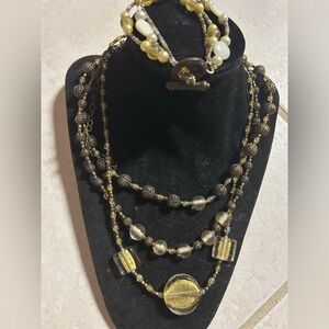 Multi strand antique brass and yellow Milano glass necklace